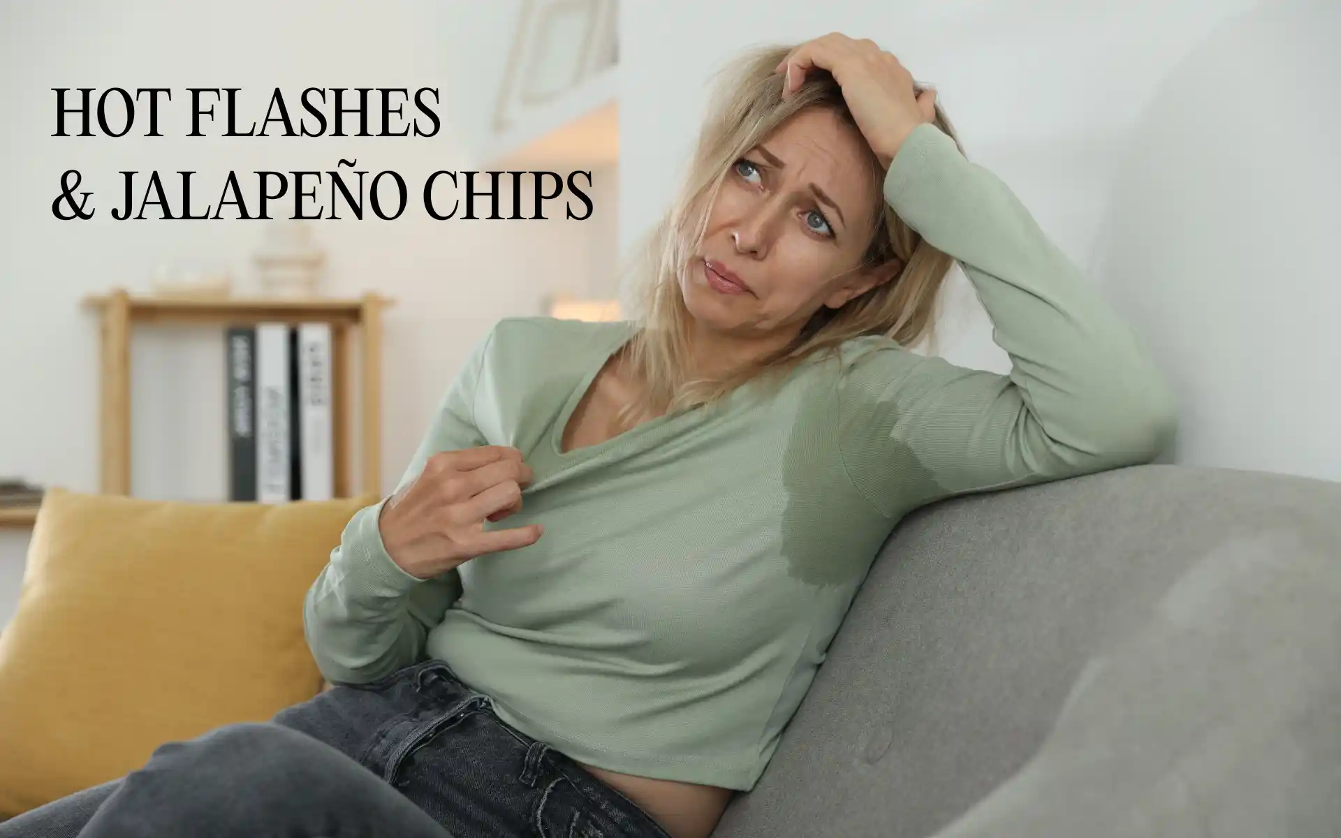 Woman fanning hot flash laughing with friends