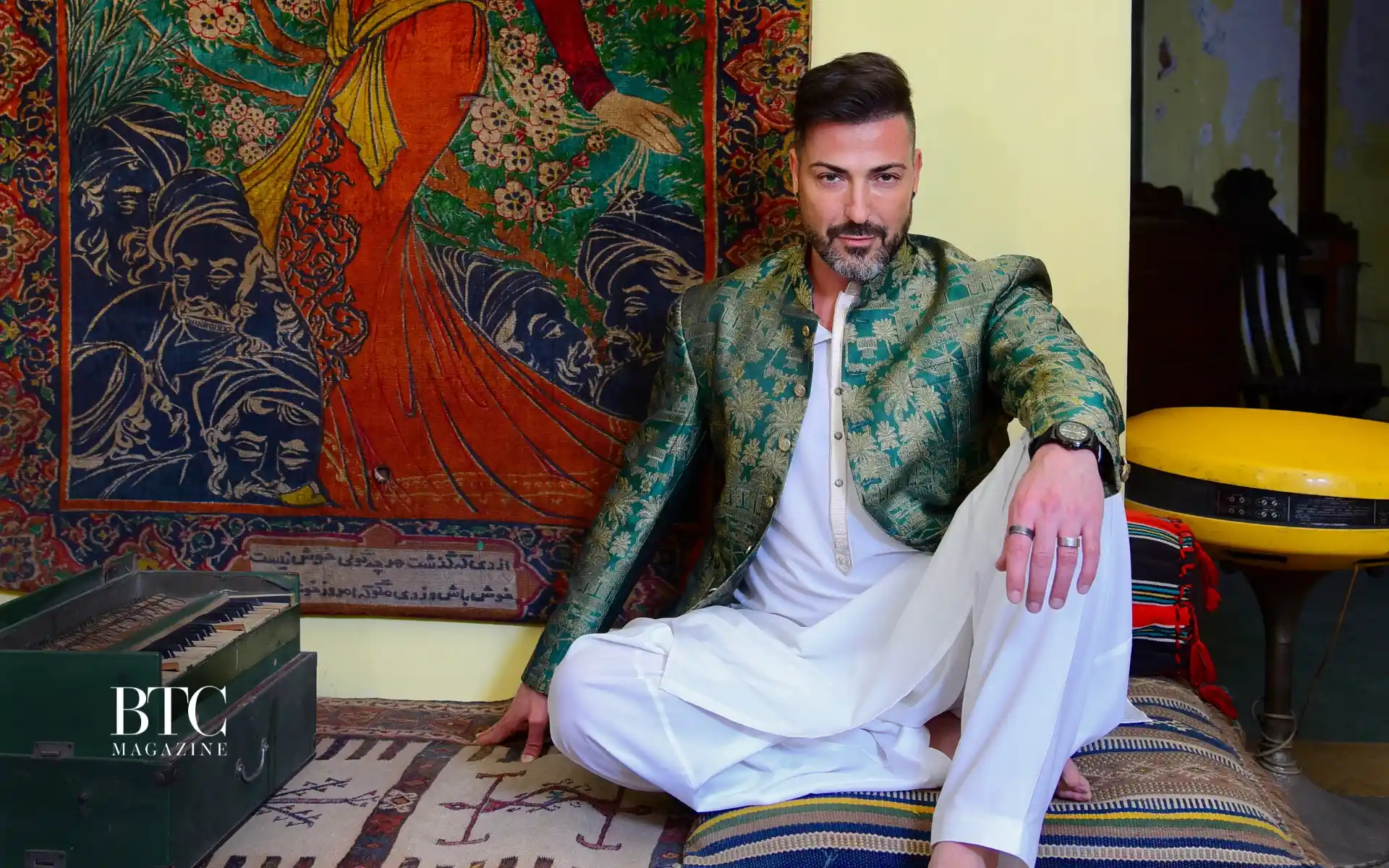 Young Pakistani journalist at laptop confident